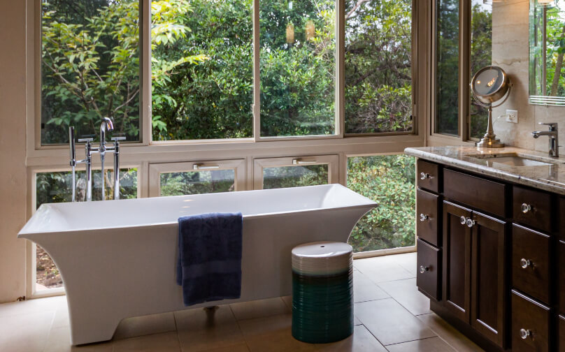 Luxury clawfoot tub overlooking forest